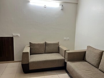 Living Room in 1.5 BHK Apartment at Auric City Homes, Sector 82 – for Rent