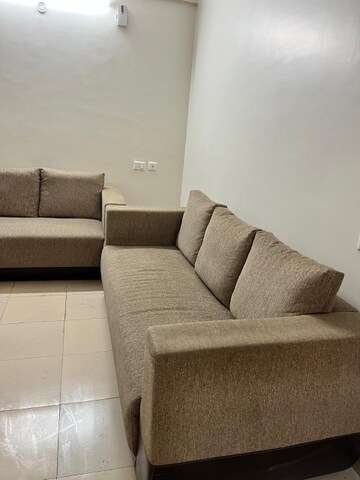 Living Room in 1.5 BHK Apartment at Auric City Homes, Sector 82 – for Rent