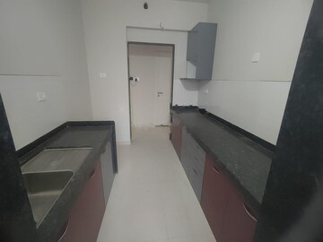 Kitchen in 2 BHK Apartment at Rustomjee Urbania, Majiwada – for Rent