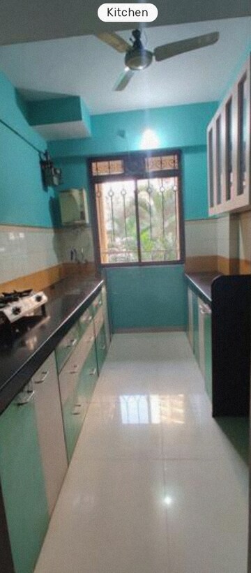Kitchen in 1 BHK Apartment at Swastik Residency Phase II CHS Ltd, Ghodbunder Road – for Rent