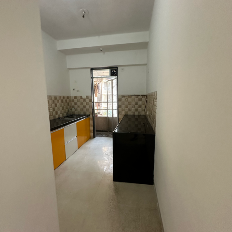 Kitchen, divine-aspen-garden 2 Bedroom 755 Sq.Ft. Apartment In Sonawala Industry Estate Mumbai 7937507