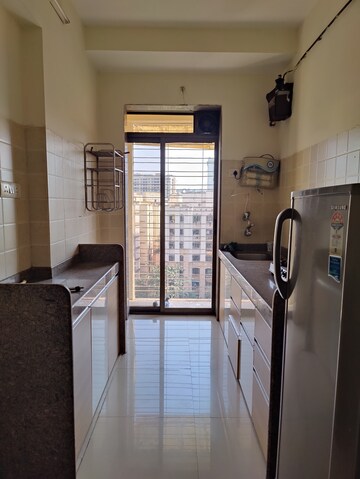 Kitchen in 1 BHK Apartment at Raunak Unnathi Woods Phase 7 A And B, Ghodbunder Road – for Rent