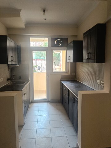 Kitchen in 2 BHK Apartment at Amrapali Silicon City, Sector 76 – for Rent