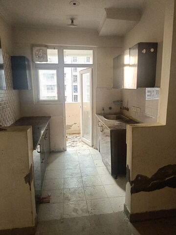 Kitchen in 2 BHK Apartment at Amrapali Silicon City, Sector 76 – for Rent