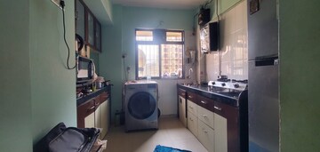 Kitchen in 1 BHK Apartment at Unnathi Woods Phase 1 And 2, Ghodbunder Road – for Sale