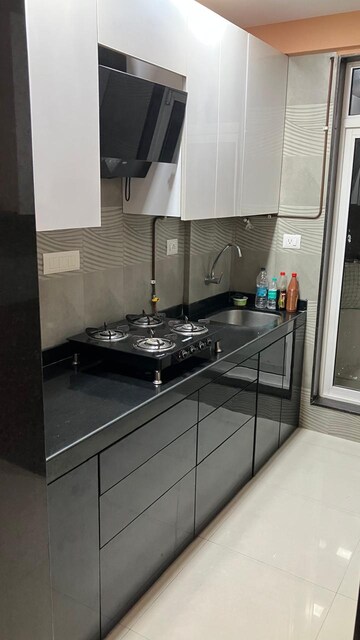 Kitchen in 1.5 BHK Apartment at Vasant Fiona, Pokhran Road No 2 – for Sale