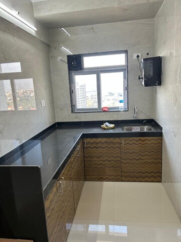 Kitchen in 2 BHK Apartment at Ameya Eastern Heights CHS, Chunnabhatti – for Rent