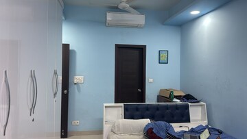 Living Room in 2 BHK Apartment at Amrapali Golf Homes, Sector 4, Greater Noida – for Sale
