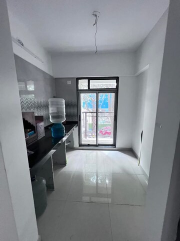 Kitchen in 2 BHK Apartment at Shrusti Saroj Sadan CHS, Naupada – for Sale