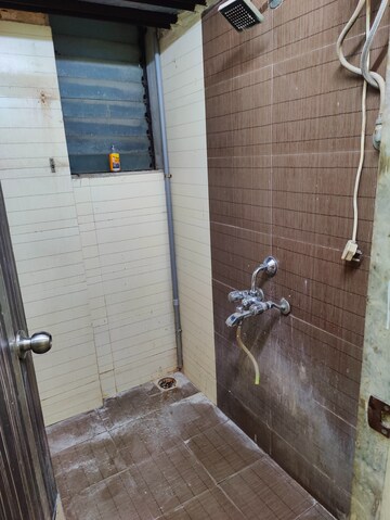 Bathroom in 1 BHK Apartment at Kavya Hill View CHS, Anand Nagar – for Rent