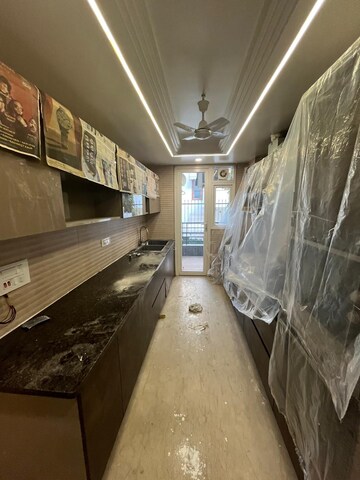 Kitchen in 4 BHK Builder Floor at Ansal Sushant Lok I, Sector 43 – for Sale