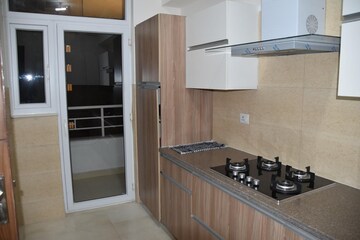 Kitchen in 3 BHK Apartment at Adani Oyster Greens, Sector 102 – for Rent