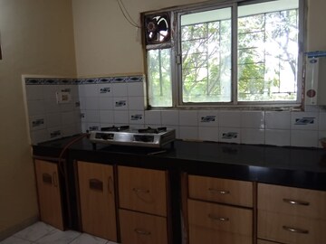Kitchen in 2 BHK Apartment at Naiknavare Trinity Court, Koregaon Park – for Rent
