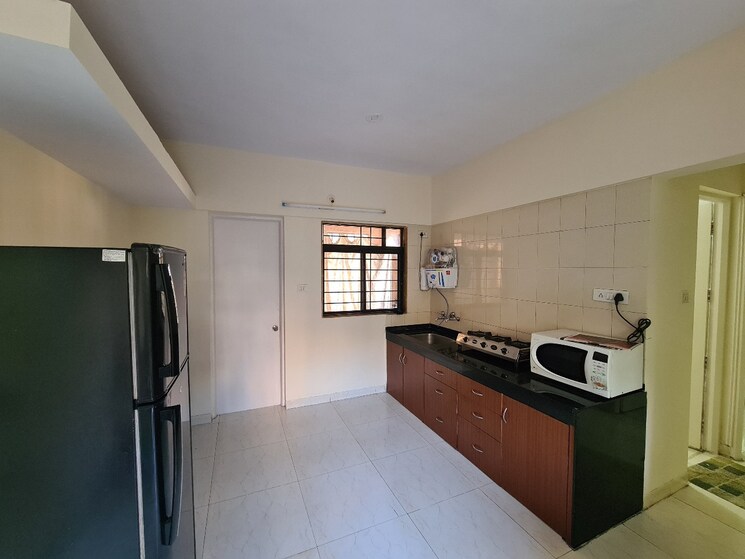 Kitchen, magarpatta-city-cosmos 2 Bedroom 1080 Sq.Ft. Apartment In Magarpatta Road Pune 7946033