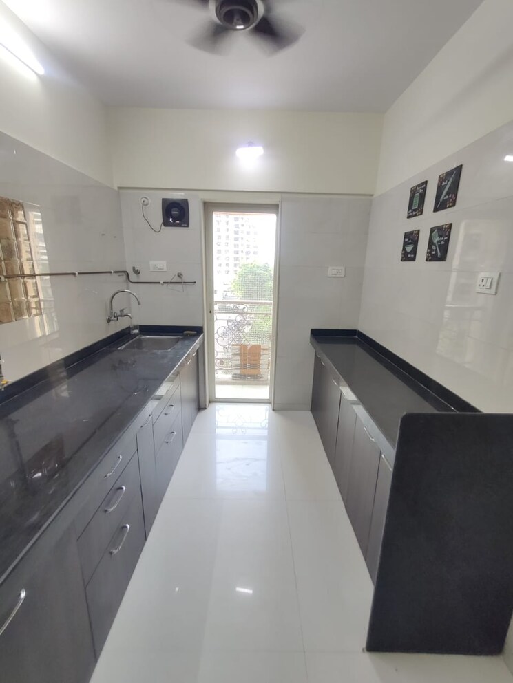 Kitchen, rosa-oasis 1 Bedroom 430 Sq.Ft. Apartment In Ghodbunder Road Thane 7947571