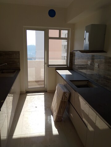 Kitchen in 4 BHK Apartment at Shapoorji Pallonji Joyville Tower Crown, Sector 102 – for Sale