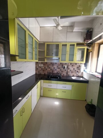 Kitchen in 1.5 BHK Apartment at Runwal Garden City, Balkum Pada – for Rent