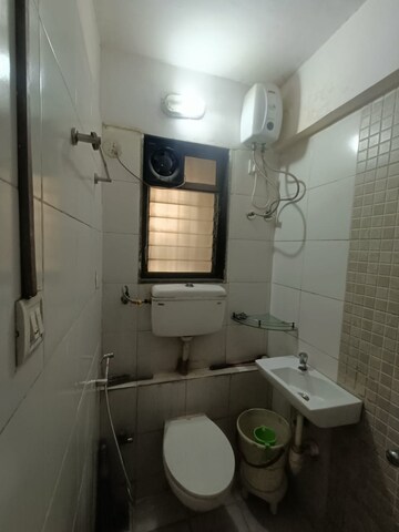 Bathroom in 1.5 BHK Apartment at Runwal Garden City, Balkum Pada – for Rent
