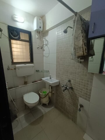Bathroom in 1.5 BHK Apartment at Runwal Garden City, Balkum Pada – for Rent