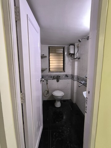 Bathroom in 1.5 BHK Apartment at Neptune CHS Andheri West, Andheri West – for Sale
