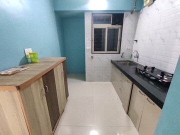 Kitchen in 1 BHK Apartment at Cosmos Lounge, Manpada – for Rent