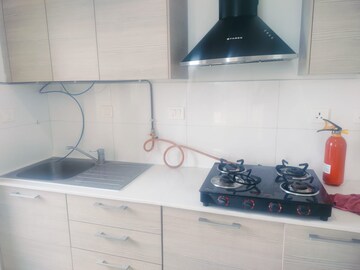 Kitchen in 3 BHK Apartment at Bhartiya Nikoo Homes Phase 2, Thanisandra Main Road – for Rent