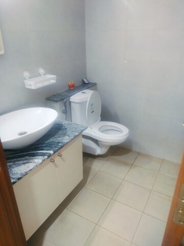 Bathroom in 3 BHK Apartment at Bhartiya Nikoo Homes Phase 2, Thanisandra Main Road – for Rent