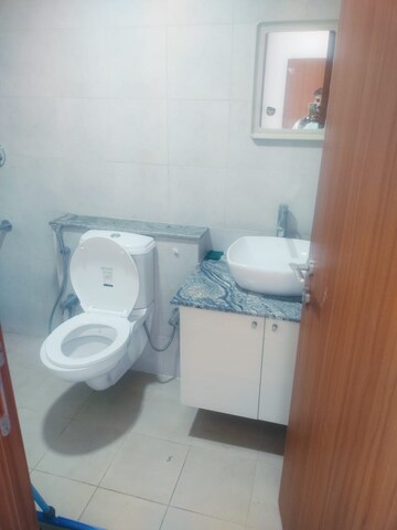 Bathroom in 3 BHK Apartment at Bhartiya Nikoo Homes Phase 2, Thanisandra Main Road – for Rent