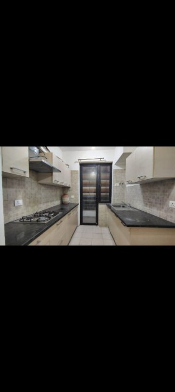 Kitchen in 2.5 BHK Apartment at Godrej Oasis, Sector 88a – for Rent