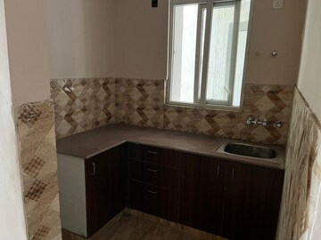Kitchen in 2 BHK Apartment at Amrapali Golf Homes, Sector 4, Greater Noida – for Sale