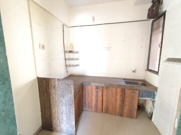 Kitchen in 2 BHK Apartment at Yashraj Park CHS, Kasarvadavali – for Sale