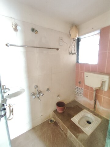 Bathroom in 2 BHK Apartment at Yashraj Park CHS, Kasarvadavali – for Sale