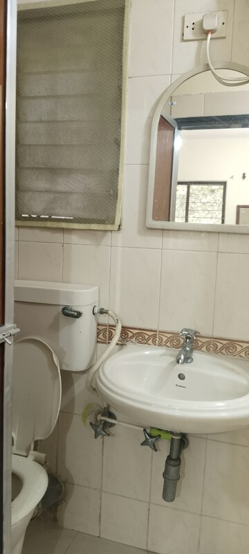 Bathroom in 2 BHK Apartment at Runwal Heights, Mulund West – for Rent