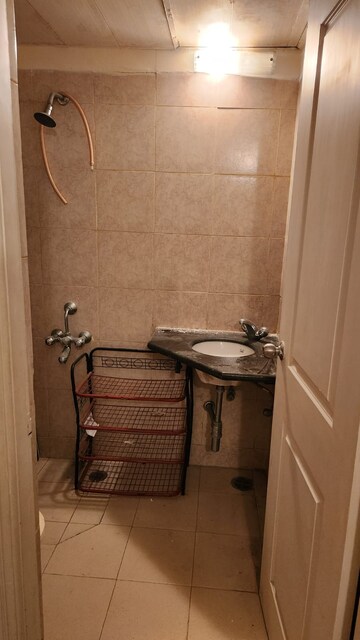 Bathroom in 3.5 BHK Apartment at Orchid Petals, Sector 49 – for Rent