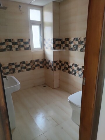 Bathroom in 3 BHK Apartment at Uninav Bliss, Raj Nagar Extension – for Rent