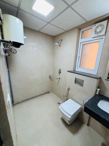 Bathroom in 3 BHK Apartment at Rishita Manhattan, Gomti Nagar – for Rent