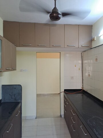 Kitchen in 2 BHK Apartment at Happy Valley, Manpada – for Sale