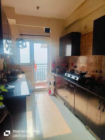 Kitchen in 2 BHK Apartment at Aims Golf City, Sector 75 – for Rent
