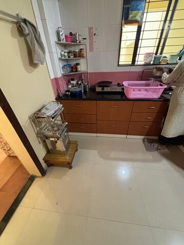Kitchen in 2 BHK Apartment at Kanchanban Apartments, Kothrud – for Rent