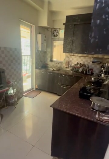 Kitchen in 2 BHK Apartment at Wall Rock Aishwaryam, Sector 16c Greater Noida – for Rent