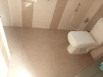 Bathroom in 3 BHK Apartment at Unique Poonam Estate Cluster 3, Mira Road – for Rent