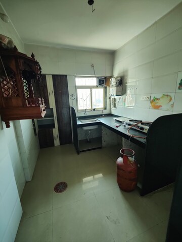 Kitchen in 2 BHK Apartment at Purshottam Nayan, Ghodbunder Road – for Rent