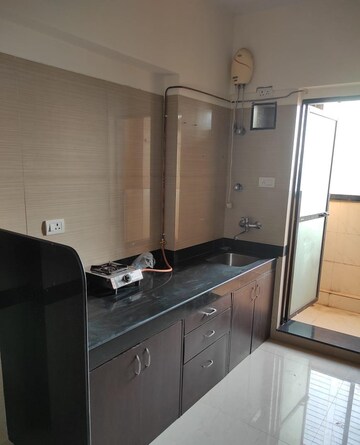 Kitchen in 2 BHK Apartment at K Raheja Heights, Malad East – for Rent