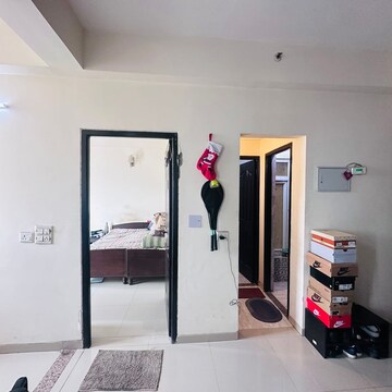 Living Room in 1.5 BHK Apartment at Raj Nagar Extension – for Rent