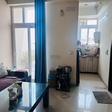 Living Room in 1.5 BHK Apartment at Raj Nagar Extension – for Rent