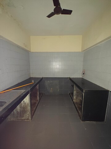Kitchen in 2 BHK Apartment at NRI Complex Phase I, Seawoods Sector 58 – for Sale