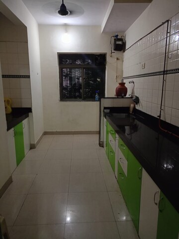 Kitchen in 2 BHK Apartment at Shubharambh Complex, Manpada – for Rent