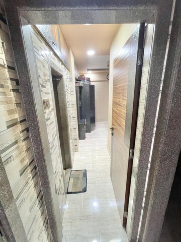 Living Room in 2 BHK Apartment at Latif Park, Mira Road – for Sale