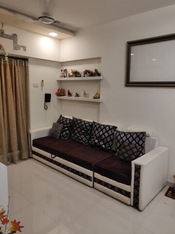 Living Room in 1 BHK Apartment at Presidency Classic Countey, Mira Road – for Rent