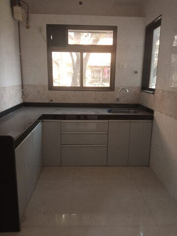 Kitchen in 2.5 BHK Apartment at Aditya Laxmi Keshav, Naupada – for Sale